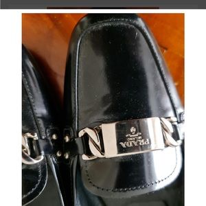 Prada unisex black patten leather loafers